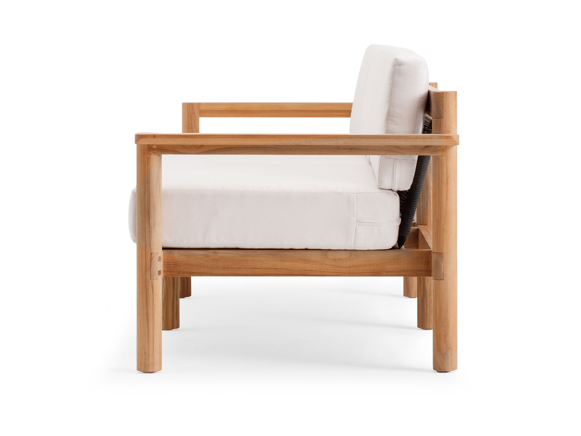 Side view of outdoor sofa with white cushions